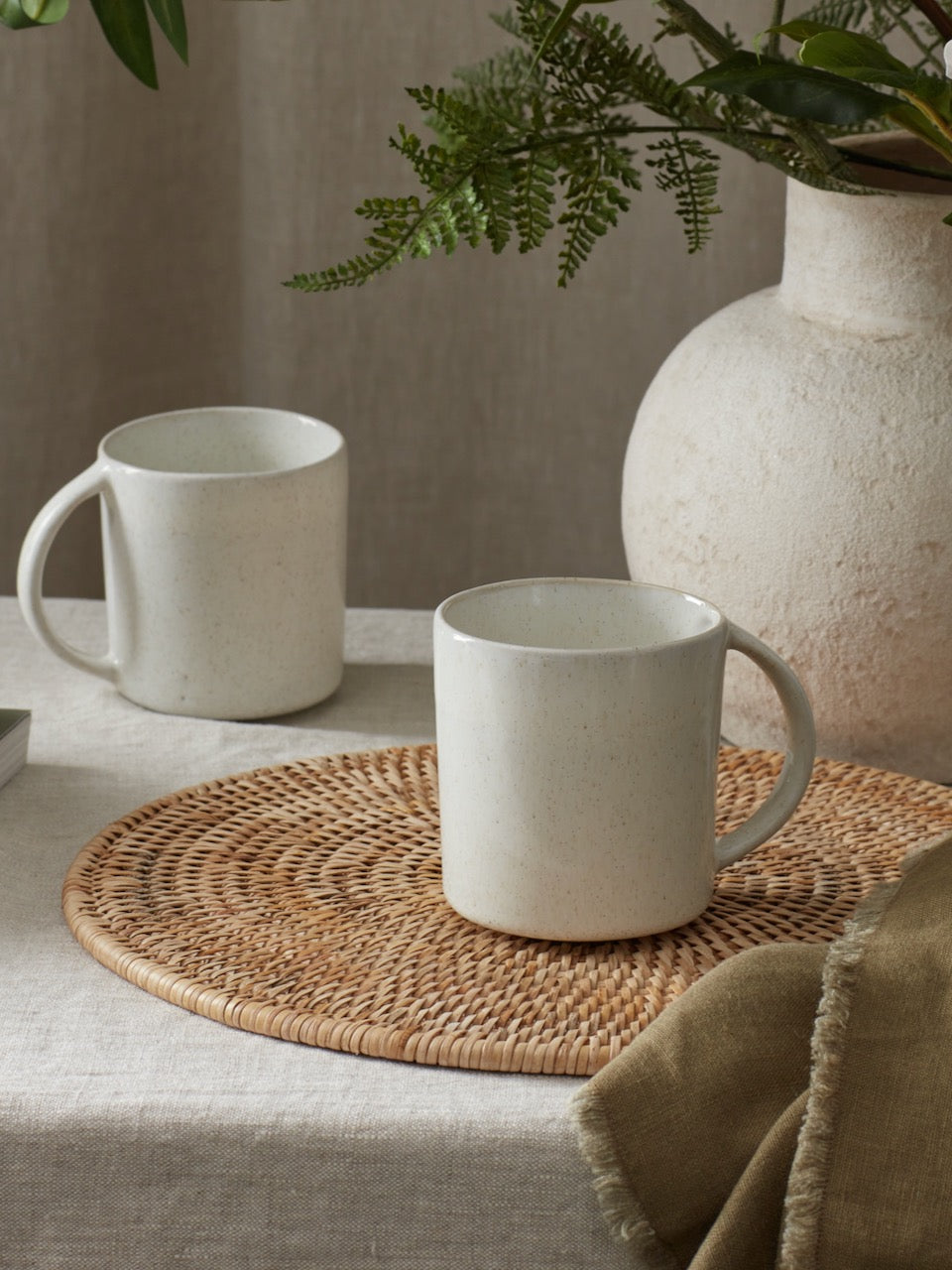 Two Azul blue mugs on table 