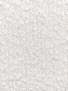 A close-up texture shot of a white or off-white plush, short-pile fabric or carpet with a soft, nubby surface.
