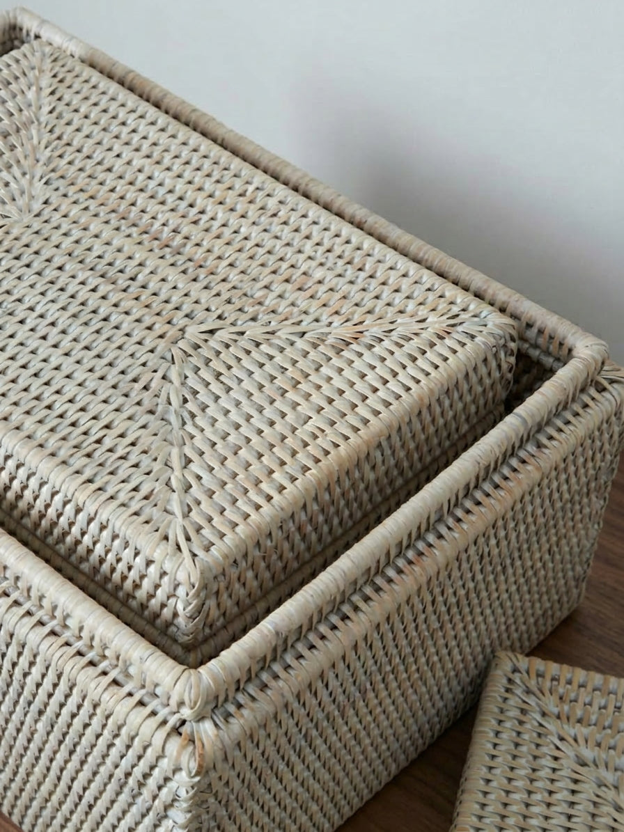 stacked white rattan storage boxes with lids, highlighting handwoven texture and durable structured design for home organisation