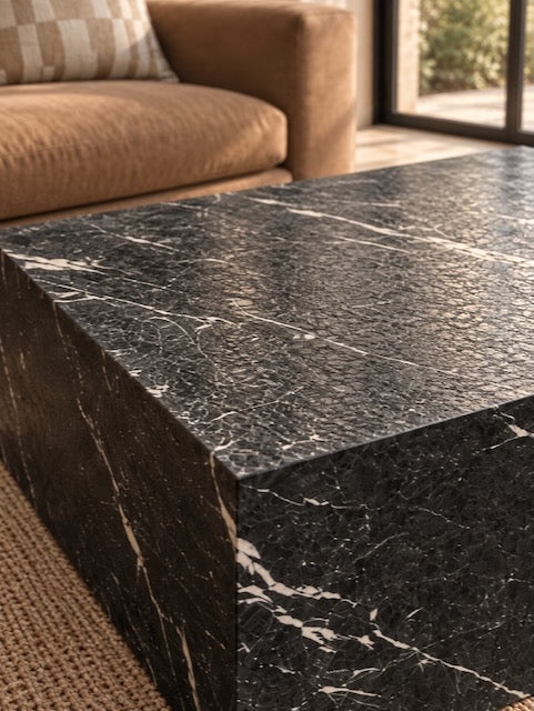 Close-up of the Marlborough Nero Marquina black marble coffee table, showing its distinctive white veining and richly textured leathered finish.
