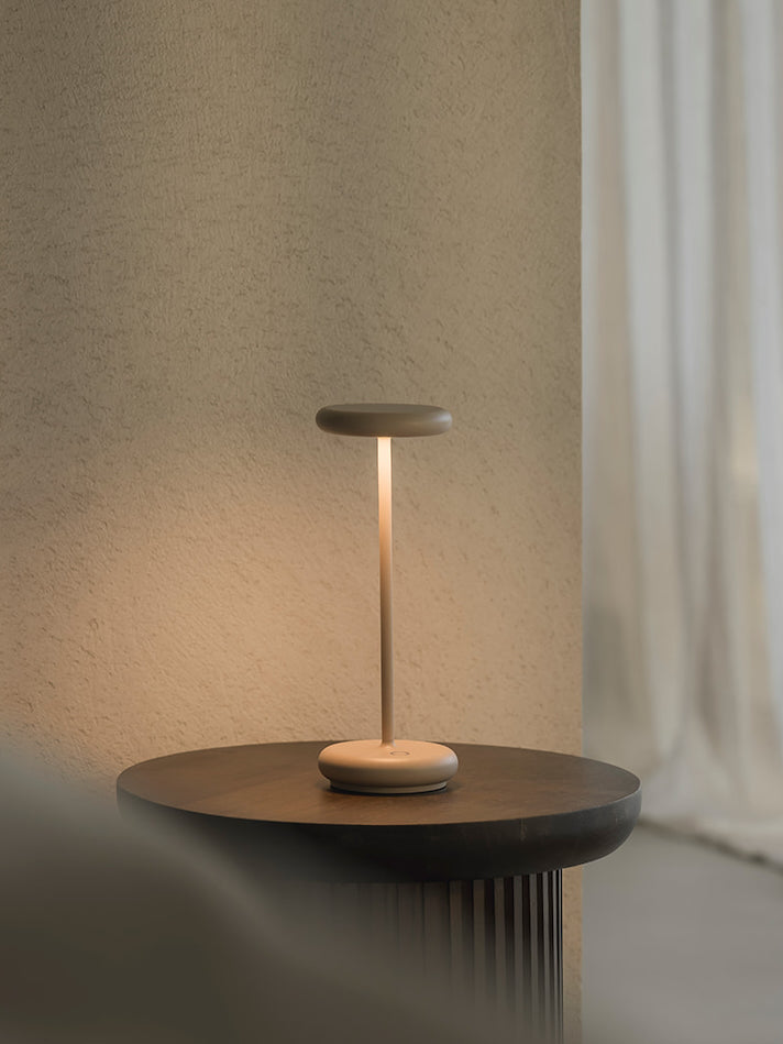 Lana sand rechargeable table lamp on round side table with soft indirect glow cordless dimmable lamp in modern neutral living space
