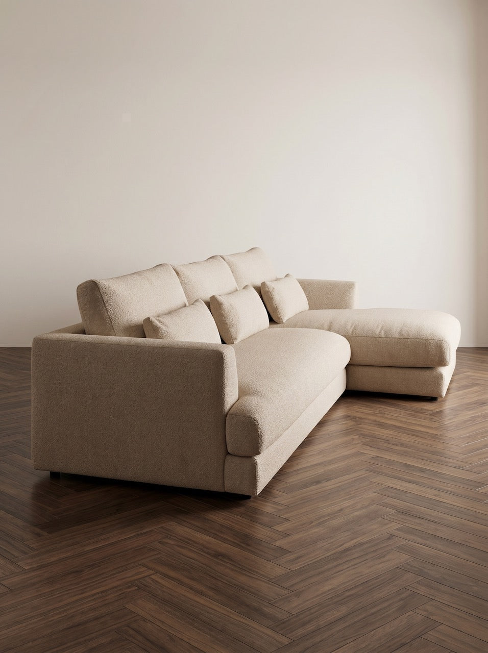 Cream fabric sofa with cushions in a contemporary lounge